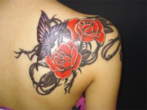 Rose Flowers And Butterflies With Barbed Wire Tattoo On Back Shoulder